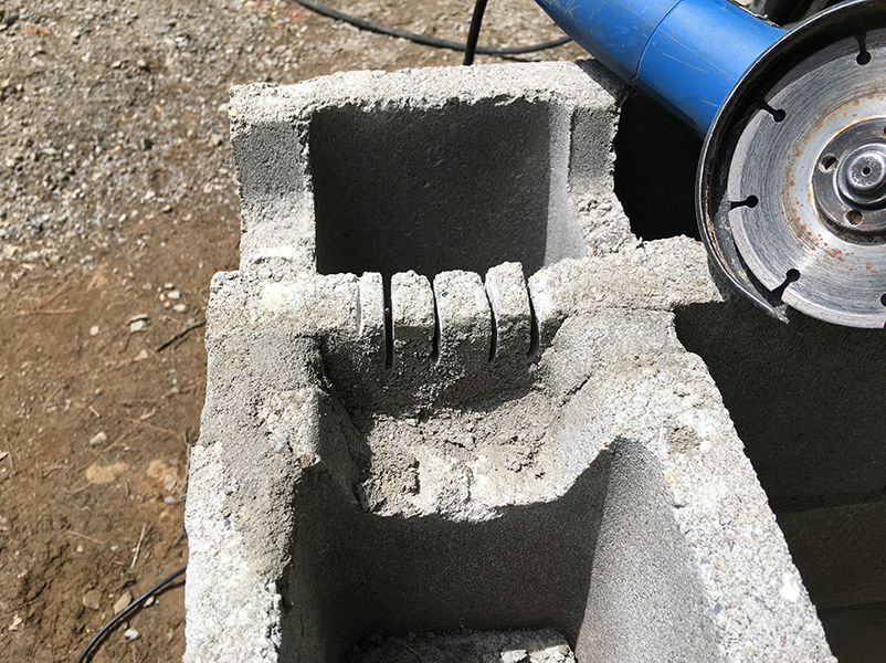 Cutting a channel for the rebar at the corner blocks